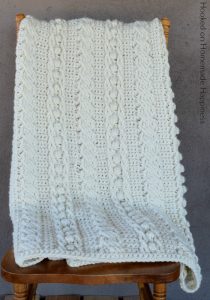 Cable Crochet Blanket Pattern - The Cable Crochet Blanket Pattern is full of beautiful texture and is easier than it looks! With a 4 row repeat you can create these gorgeous cables.