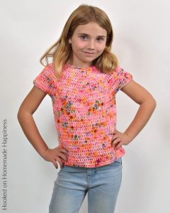 Kid's Basic Tee Crochet Pattern - The Kid's Basic Tee Crochet Pattern is a super easy kid's top that uses worsted weight yarn and all double crochet. The best part is... there's no sewing!